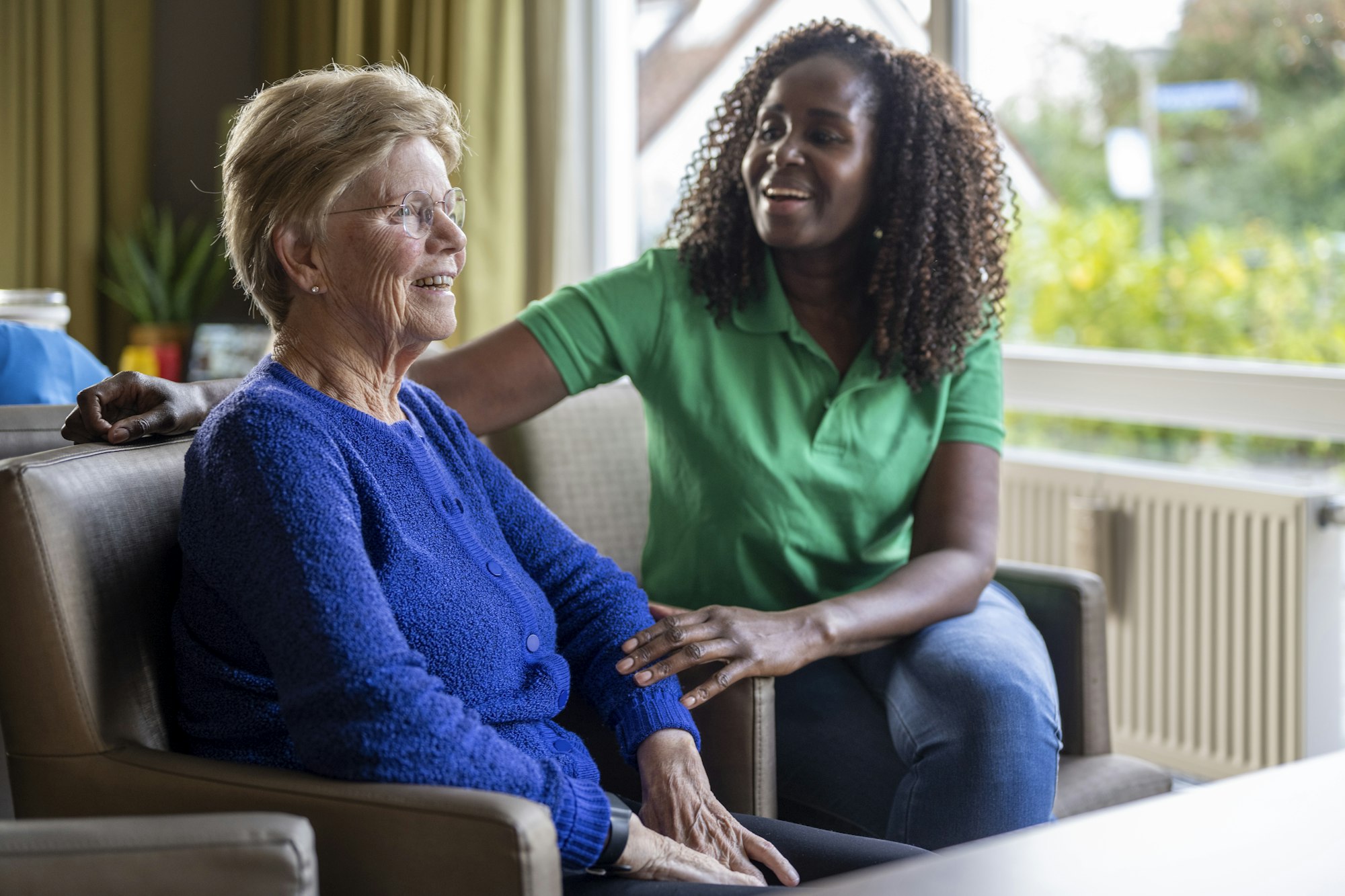 Helper caring for elderly lady